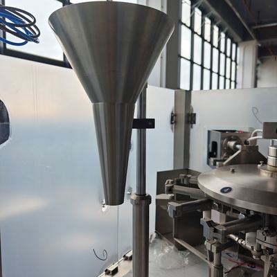 Filling 1 station â stainless steel funnel feeding primary product into the pouch